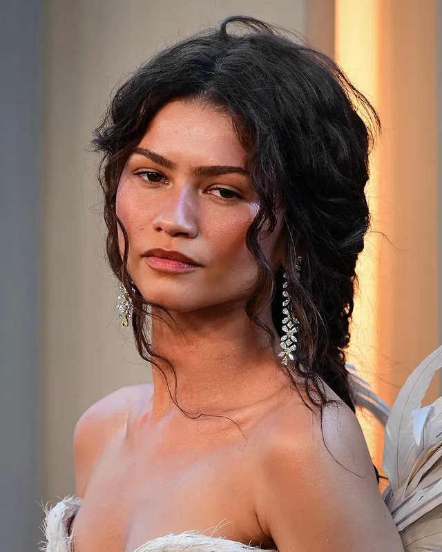 Zendaya at the New York premiere of The Odyssey in 2026, linked to Idôle and Prada Paradoxe perfumes